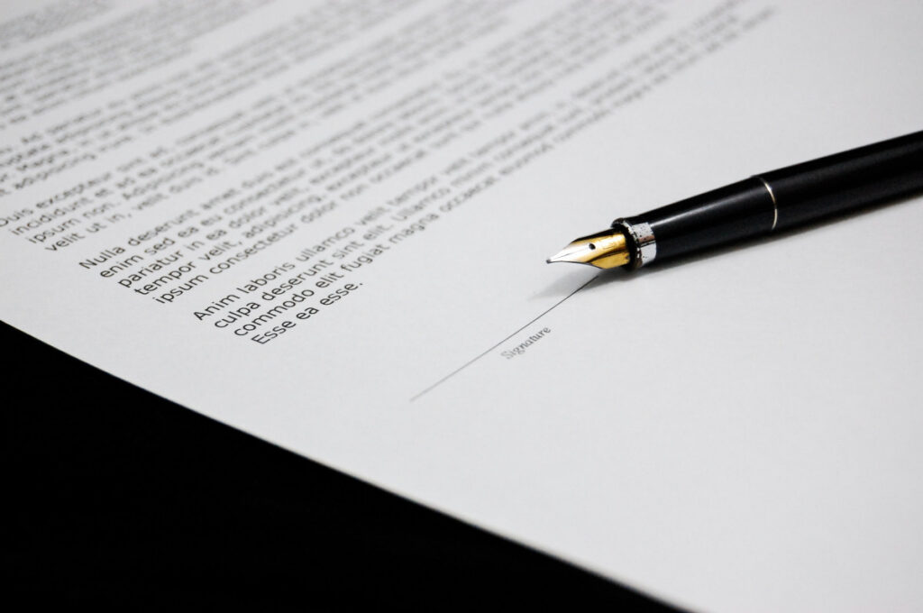 Signing a document with a pen — transferring an LEI number from one service provider to another